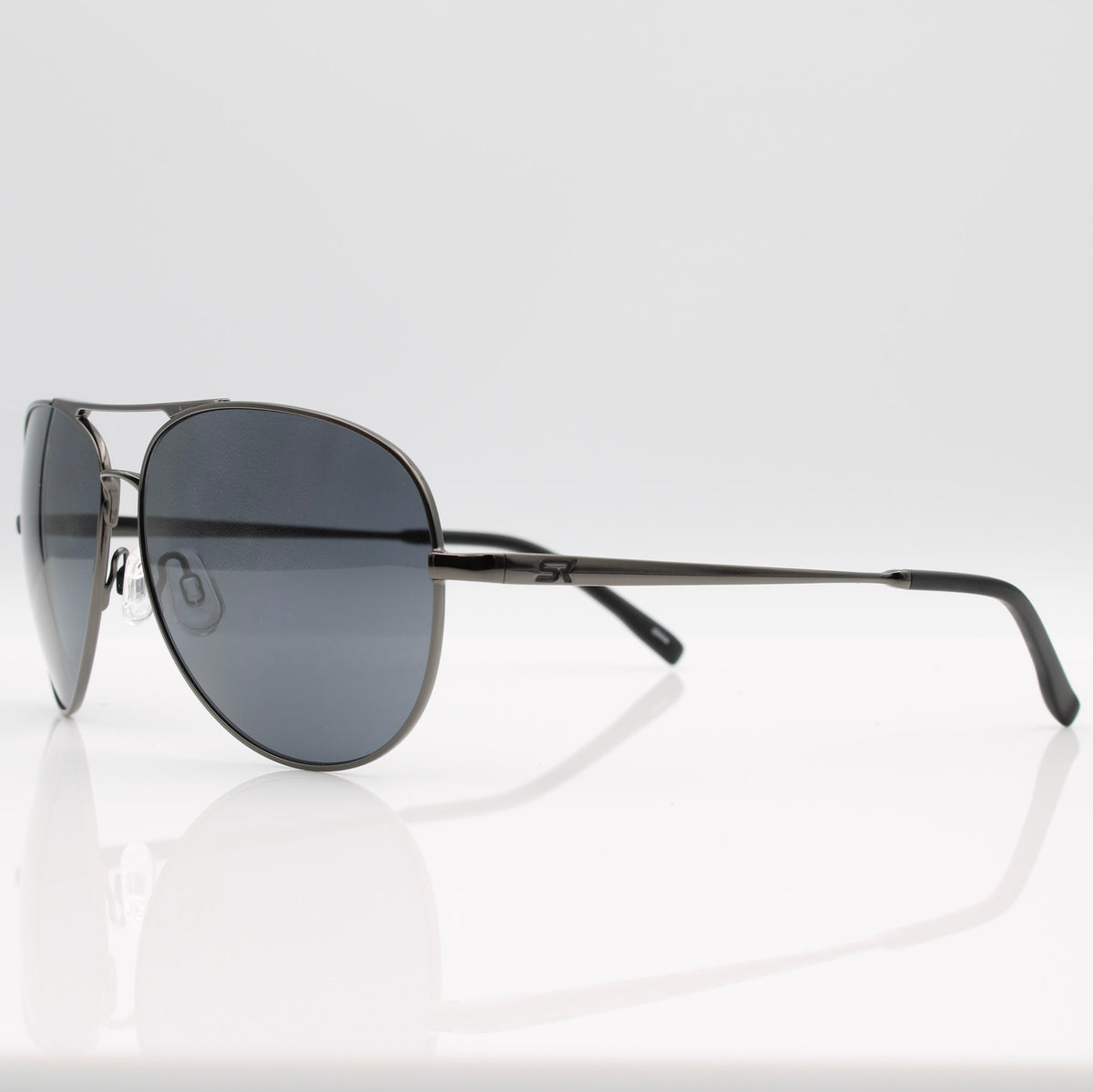 Gunmetal Blackbird Aviator sunglasses with gray lenses, angled side profile showing lightweight metal frame.