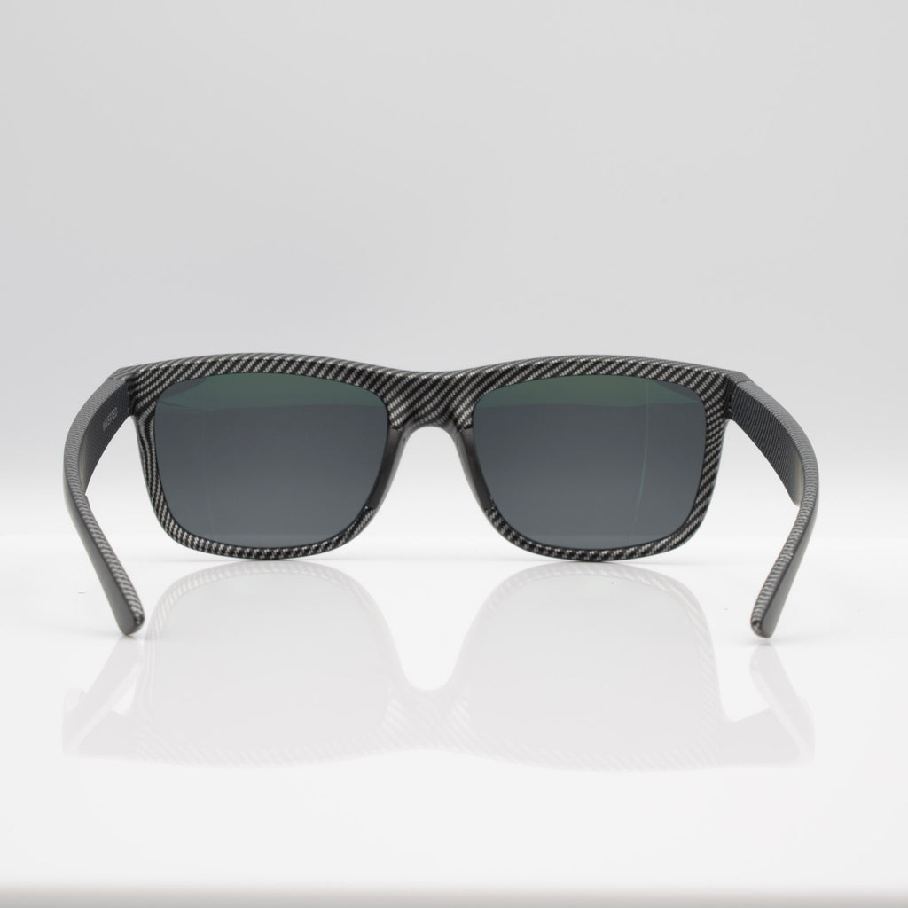 Matte Black Carbon Inverted sunglasses with gray lenses, side profile showing carbon-inspired frame detail.