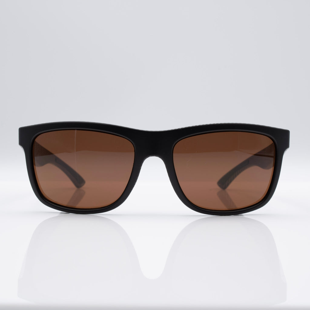 Matte Black Carbon Inverted sunglasses with bronze lenses, angled profile showing carbon-inspired frame detail.