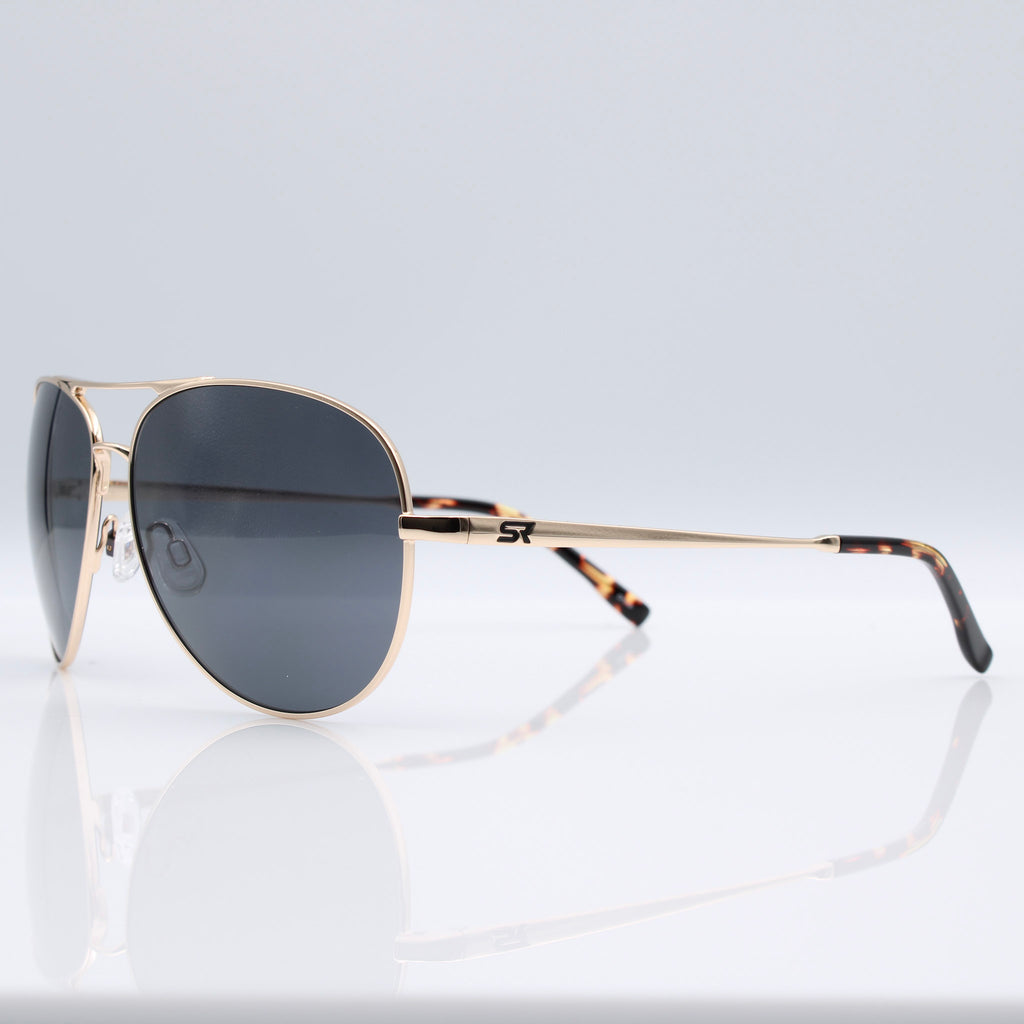 Heritage Gold Blackbird Aviator sunglasses with gray lenses shown with SR performance case, pouch, and box.