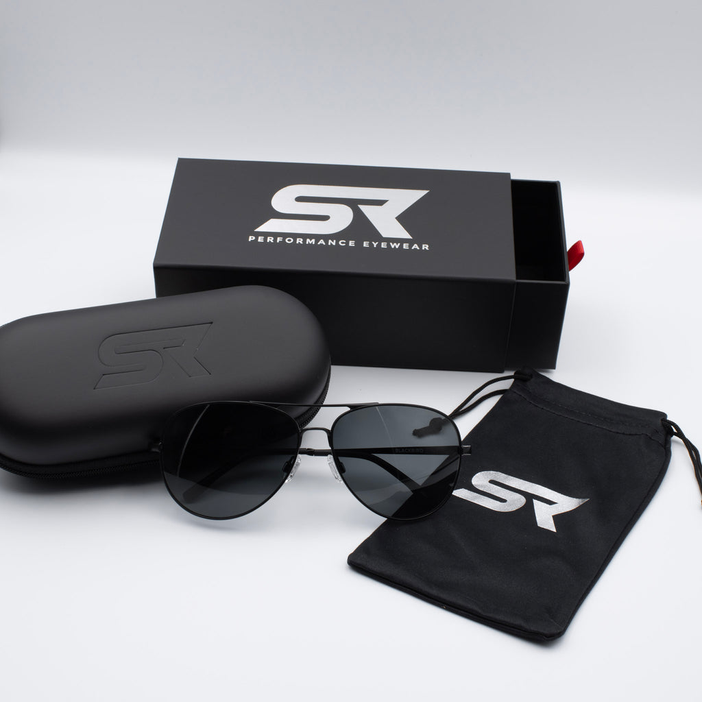 Matte Stealth Black Blackbird Aviator sunglasses with gray lenses and premium SR Performance Eyewear packaging.