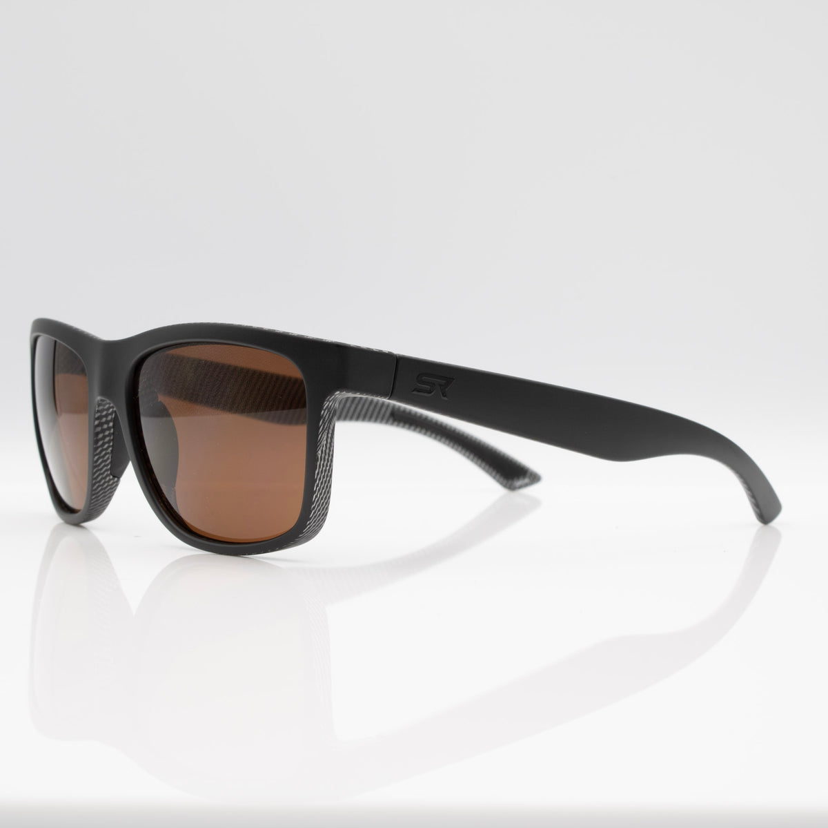 Matte Black Carbon Inverted sunglasses with bronze lenses, side profile showing performance temple design.