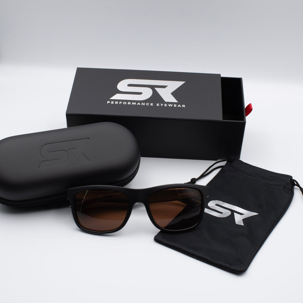 Matte Black Carbon Inverted sunglasses with bronze lenses and premium SR Performance Eyewear packaging.