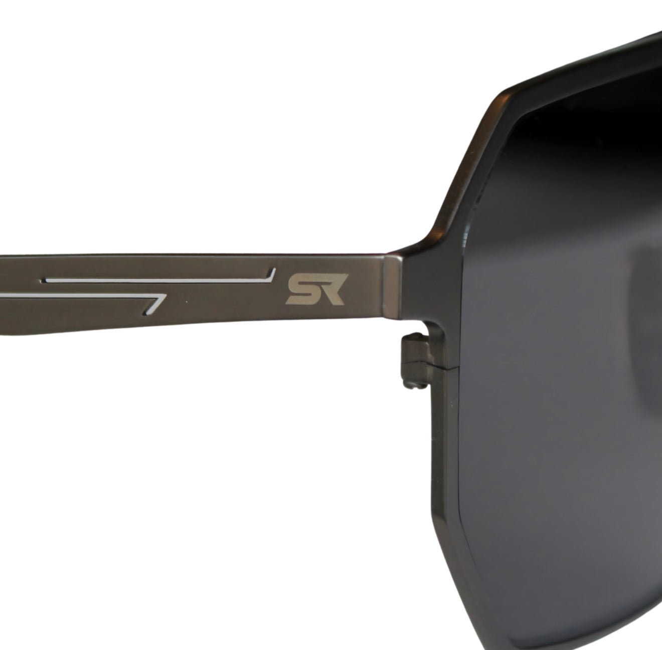 Close-up of SR Performance Eyewear Vector sunglasses showing pure titanium gunmetal frame and engraved SR logo