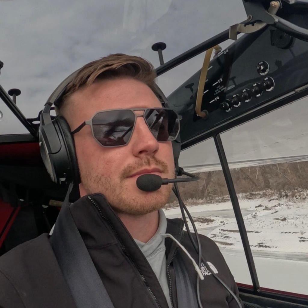 Pilot flying an aircraft while wearing SR Performance Eyewear Vector sunglasses in the cockpit