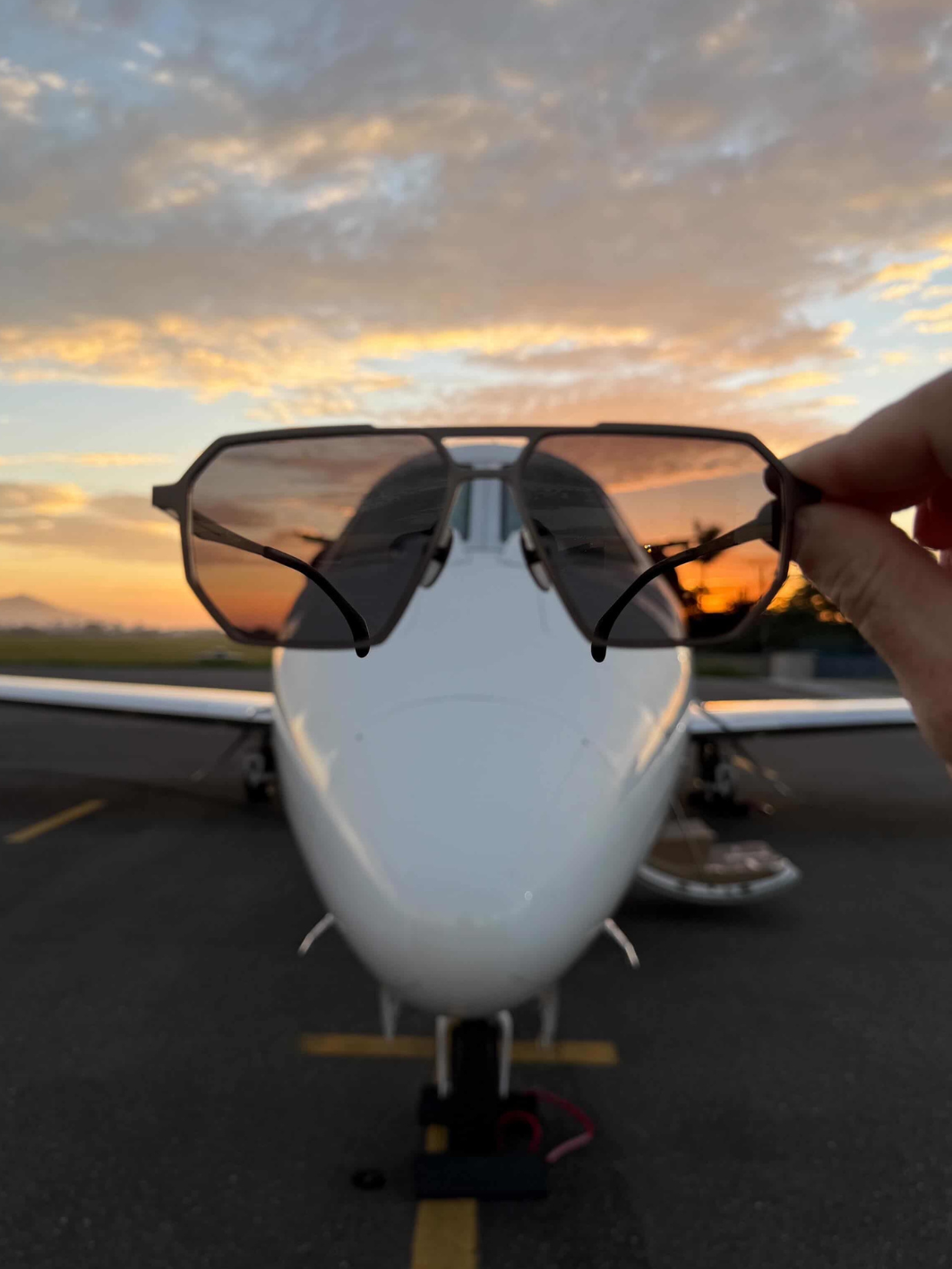 SR Performance Eyewear sunglasses in front of private jet