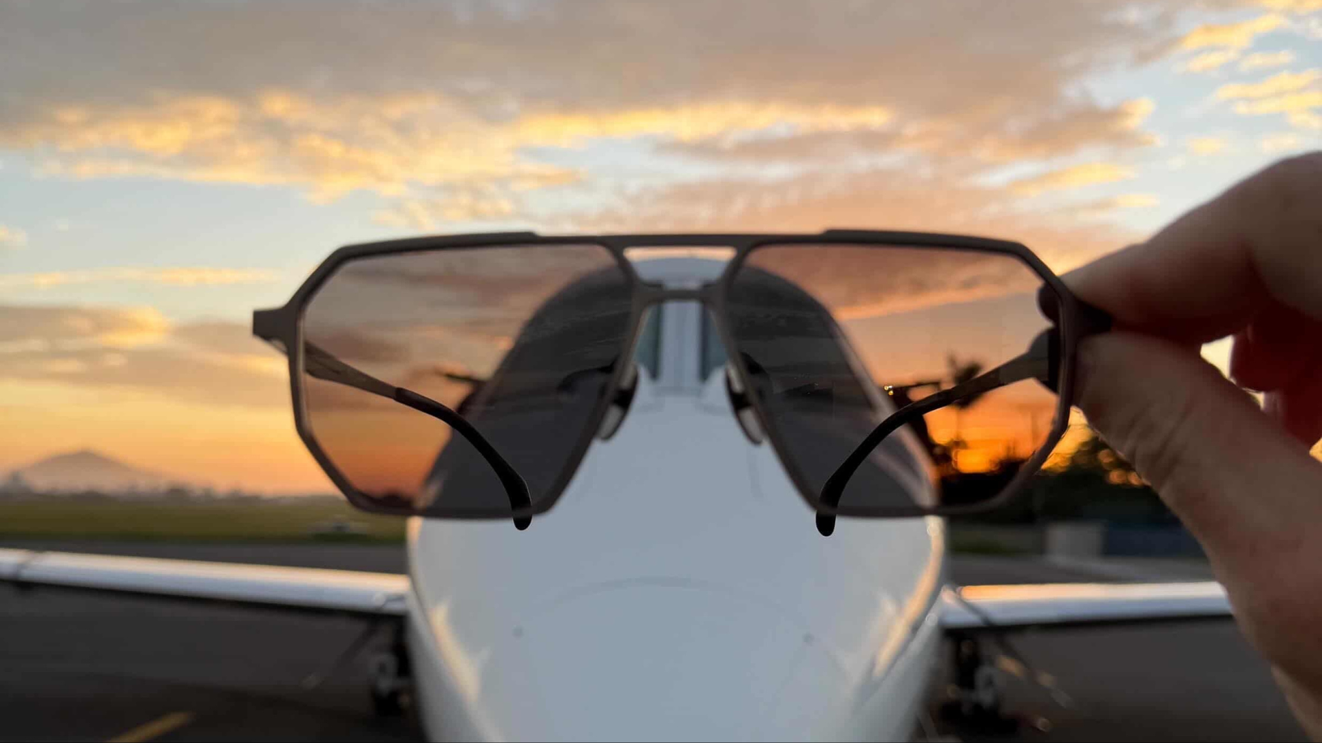 SR Performance Eyewear sunglasses in front of private jet